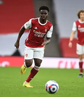 Arsenal's Bukayo Saka in Action Against Tottenham in Empty Emirates Stadium, Premier League 2020-21