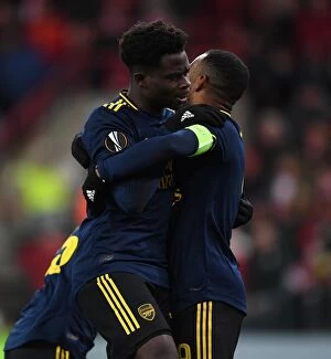 Images Dated 13th December 2019: Arsenal's Bukayo Saka and Alexandre Lacazette Celebrate Goals in Standard Liege Victory