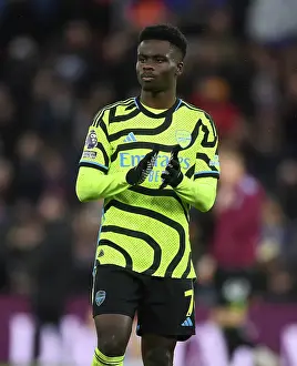 Arsenal's Bukayo Saka Celebrates with Fans after Aston Villa Victory (2023-24)