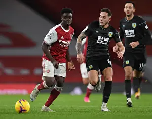 Arsenal's Bukayo Saka Clashes with Burnley's Josh Brownhill in Premier League Showdown