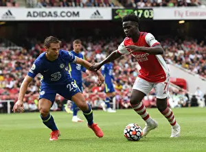 Arsenal V Chelsea 2021-22 Prints: Arsenal's Bukayo Saka Clashes with Chelsea's Cesar Azpilicueta in the 2021-22 Premier League Match