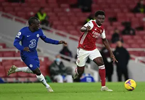 Arsenal's Bukayo Saka Clashes with Chelsea's N'Golo Kante in Premier League Showdown