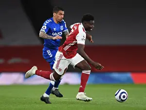 Arsenal's Bukayo Saka Clashes with Everton's Allan in Premier League Showdown