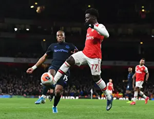 Arsenal's Bukayo Saka Clashes with Everton's Djibril Sidibe in Premier League Showdown