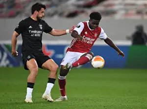 Arsenal V SL Benfica 2020-21 Prints: Arsenal's Bukayo Saka Clashes with Gabriel in Europa League Showdown vs SL Benfica