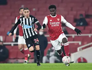 Arsenal's Bukayo Saka Clashes with Newcastle's Miguel Almiron in FA Cup Third Round