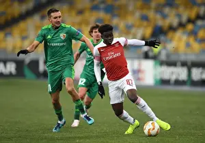 FC Vorskla Poltava V Arsenal 2018-19 Prints: Arsenal's Bukayo Saka Clashes with Vyacheslav Sharpar of Vorskla in Europa League Match