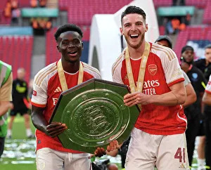 Arsenal's Bukayo Saka and Declan Rice Celebrate FA Community Shield Victory over Manchester City