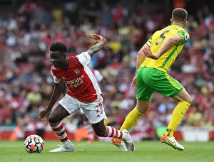 Arsenal V Norwich City 2021-22 Prints: Arsenal's Bukayo Saka Dodges Norwich's Hanley in Thrilling 2021-22 Premier League Clash