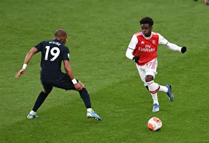 Arsenal V Everton 2019-20 Prints: Arsenal's Bukayo Saka Evades Everton's Djibril Sidibe: Premier League Showdown at Emirates Stadium
