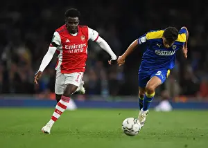 Arsenal V AFC Wimbledon 2021-22 Prints: Arsenal's Bukayo Saka Faces Off Against AFC Wimbledon's Will Nightingale in Carabao Cup Clash