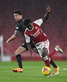Arsenal V Burnley 2020-21 Prints: Arsenal's Bukayo Saka Faces Off Against Burnley's Robbie Brady in Premier League Clash