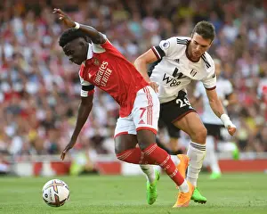 Arsenal V Fulham 2022-23 Prints: Arsenal's Bukayo Saka Faces Off Against Fulham's Joao Palhinha in Premier League Clash