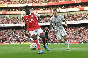 Arsenal V Liverpool 2022-23 Prints: Arsenal's Bukayo Saka Faces Off Against Liverpool in Thrilling 2022-23 Premier League Clash