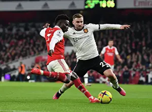 Arsenal's Bukayo Saka Faces Off Against Luke Shaw in Intense Arsenal v Manchester United Clash (2022-23)