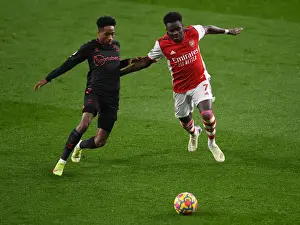 Arsenal V Southampton 2021-22 Prints: Arsenal's Bukayo Saka Faces Off Against Southampton's Kyle Walker-Peters in Premier League Clash