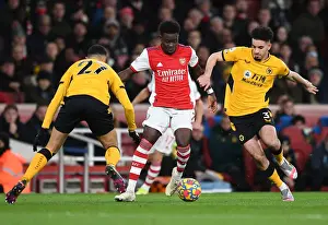 Arsenal's Bukayo Saka Faces Off Against Wolves Rayan Ait-Nouri in Premier League Clash