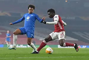 Arsenal's Bukayo Saka Fends Off Molde's Henry Wingo in Europa League Clash