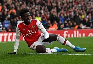 Arsenal v Chelsea 2019-20 Collection: Arsenal's Bukayo Saka Goes Head-to-Head with Chelsea in Premier League Clash