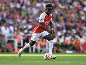 Arsenal's Bukayo Saka Goes Head-to-Head with Manchester United in the 2023-24 Premier League Showdown