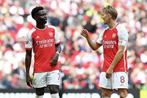 Arsenal's Bukayo Saka and Martin Odegaard Interact During FA Community Shield Match vs Manchester City (2023-24)