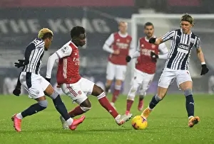West Bromwich Albion V Arsenal 2020-21 Prints: Arsenal's Bukayo Saka Navigates Past West Bromwich Albion's Diangana and Gallagher in Premier League Clash
