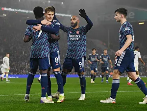 Arsenal's Bukayo Saka, Odegaard, Lacazette, and Tierney Celebrate Goals Against Leeds United (December 2021)