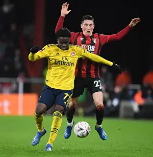 AFC Bournemouth V Arsenal - FA Cup 4th Rd 2020 Prints: Arsenal's Bukayo Saka Outsmarts Harry Wilson: FA Cup Victory Moment