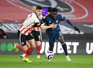 Arsenal's Bukayo Saka Outsmarts Sheffield United's John Egan in Empty Bramall Lane