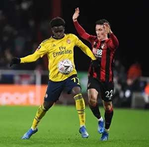 AFC Bournemouth V Arsenal - FA Cup 4th Rd 2020 Prints: Arsenal's Bukayo Saka Outwits Harry Wilson: FA Cup Victory Moment