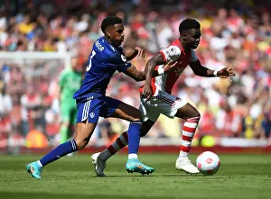 Arsenal V Leeds United 2021_22 Prints: Arsenal's Bukayo Saka Outwits Junior Firpo in Premier League's Thrilling Showdown