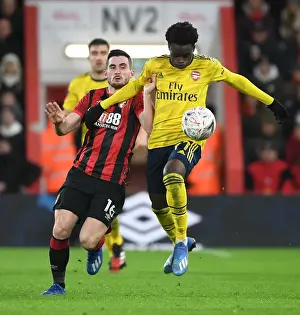 AFC Bournemouth V Arsenal - FA Cup 4th Rd 2020 Prints: Arsenal's Bukayo Saka Outwits Lewis Cook: FA Cup Victory Moment