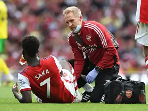 Arsenal's Bukayo Saka Receives Treatment from Physio during Arsenal v Norwich City Match, 2021-22 Season