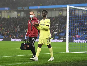 Arsenal's Bukayo Saka Receives Treatment from Physio during Brighton Match