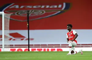 Arsenal V Liverpool 2019-20 Prints: Arsenal's Bukayo Saka Takes a Knee at Empty Emirates Stadium During Arsenal v Liverpool Match