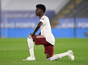 Images Dated 24th September 2020: Arsenal's Bukayo Saka Takes a Knee During Leicester City vs Arsenal Carabao Cup Match