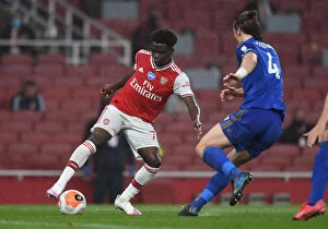 Arsenal v Leicester City 2019-20 Collection: Arsenal's Bukayo Saka Tangles with Leicester's Caglar Soyuncu in Premier League Clash
