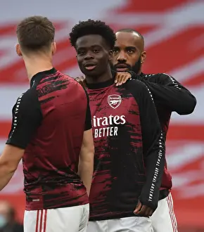 Arsenal V Leicester City 2019-20 Prints: Arsenal's Bukayo Saka Warming Up Ahead of Arsenal v Leicester City Premier League Clash