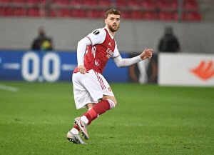 Images Dated 25th February 2021: Arsenal's Calum Chambers in Action against SL Benfica in the Europa League Round of 32, Piraeus
