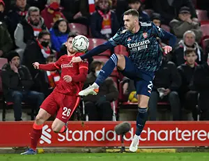 Arsenal's Calum Chambers Faces Off Against Liverpool's Andrew Robertson in Carabao Cup Semi-Final Clash
