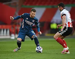 Arsenal's Calum Chambers Faces Off Against Sheffield United's Enda Stevens in Empty Bramall Lane - Premier League Clash 2021