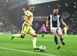 Arsenal's Calum Chambers Faces Off Against West Bromwich Albion's Robert Snodgrass in Carabao Cup Clash