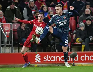 Arsenal's Calum Chambers Faces Pressure from Liverpool's Andrew Robertson in Carabao Cup Semi-Final Clash