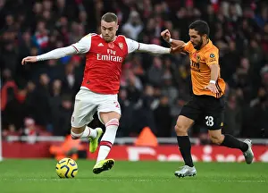 Arsenal's Calum Chambers Outmaneuvers Joao Moutinho in Premier League Clash vs. Wolverhampton Wanderers
