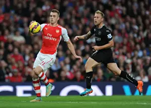 Arsenal V Burnley 2014/15 Prints: Arsenal's Calum Chambers Outruns Burnley's Scott Arfield in 2014/15 Premier League Clash