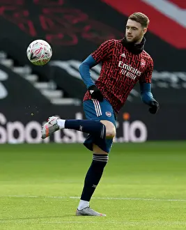 Arsenal's Calum Chambers Prepares for FA Cup Clash Against Southampton Amidst Empty Stands