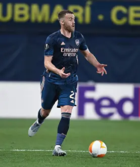 Villarreal V Arsenal 2020-21 Prints: Arsenal's Calum Chambers at Villarreal's Empty Estadio de la Ceramica in UEFA Europa League Semi-Final