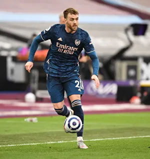 Arsenal's Calum Chambers at Empty West Ham Stadium: 2020-21 Premier League Match Amidst COVID-19 Restrictions