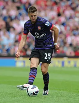 Stoke City V Arsenal 2012-13 Prints: Arsenal's Carl Jenkinson Faces Off Against Stoke City in 2012-13 Premier League Clash