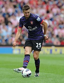 Stoke City v Arsenal 2012-13 Collection: Arsenal's Carl Jenkinson Faces Off Against Stoke City in 2012-13 Premier League Clash